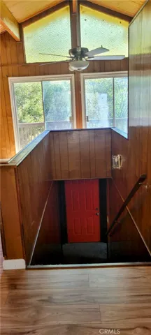 Stairs going to 2nd floor and door to another deck