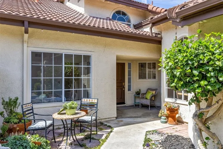 The charming courtyard welcomes guests.