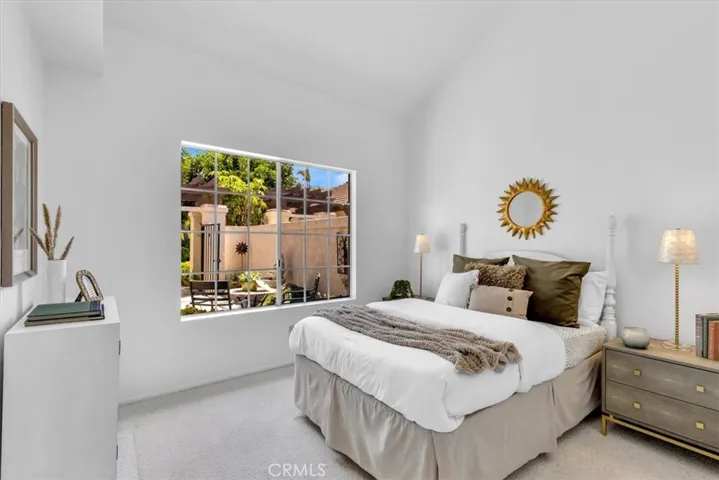 Secondary bedroom is also located on the main floor and overlooks the front courtyard.