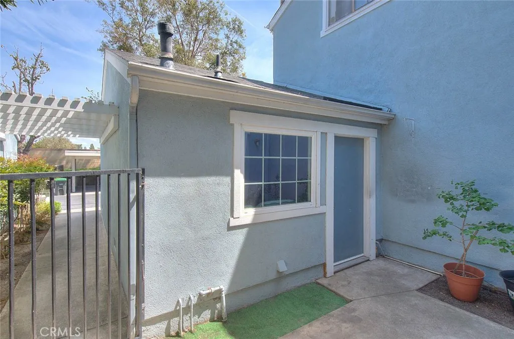 Garage has pedestrian door that leads to courtyard