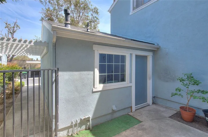 Garage has pedestrian door that leads to courtyard