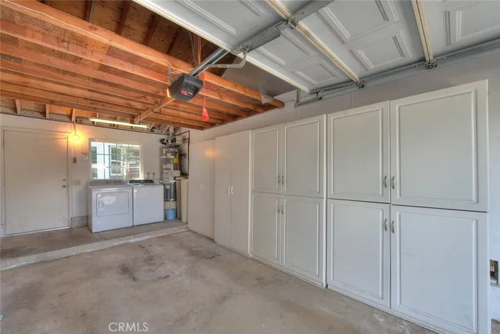 Laundry and additional storage cabinets in the garage