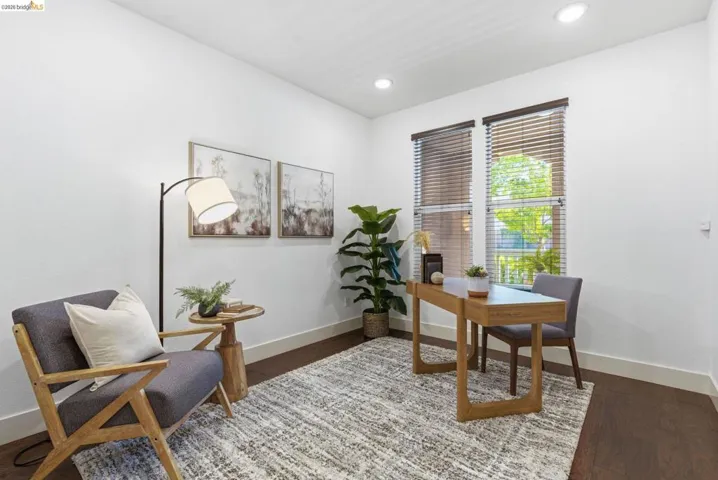 Office featuring wood finished floors and recessed lighting