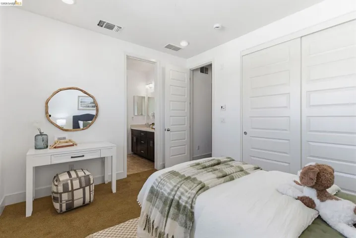 Bedroom featuring a closet and carpet