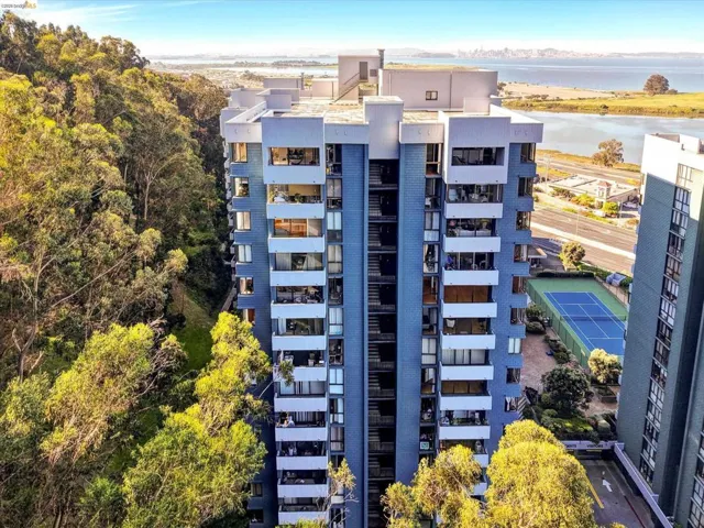 View of apartment building / complex with a water view