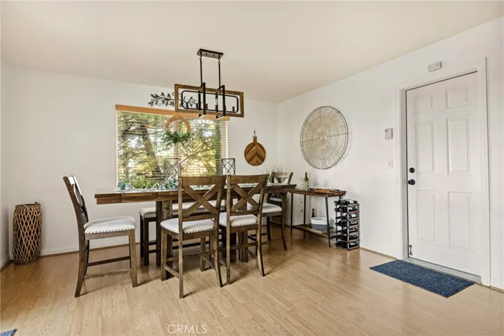 Dining area open to kitchen and attached garage access.