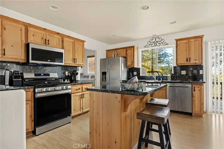 Kitchen with eat at bar.