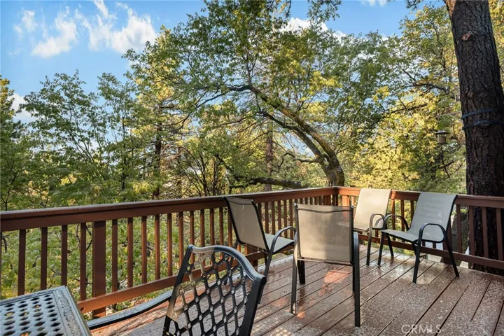 Back deck with beautiful tree views.