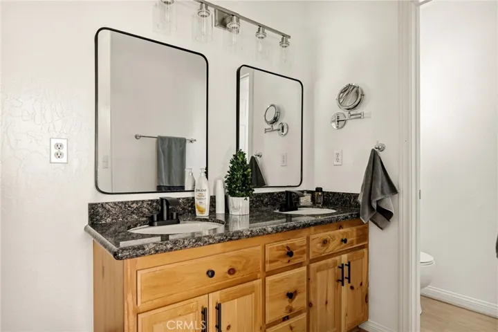 Primary bathroom with dual sinks.