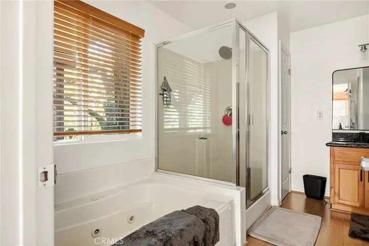 Primary bathroom with soaking tub and walk in shower.