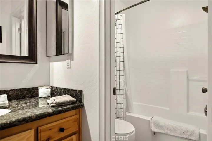 Full bathroom w/ tub-shower.