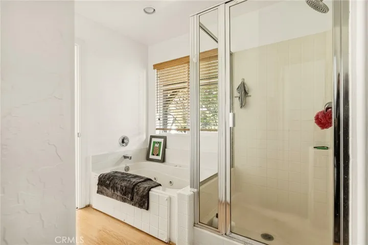 Primary bathroom with soaking tub and walk in shower