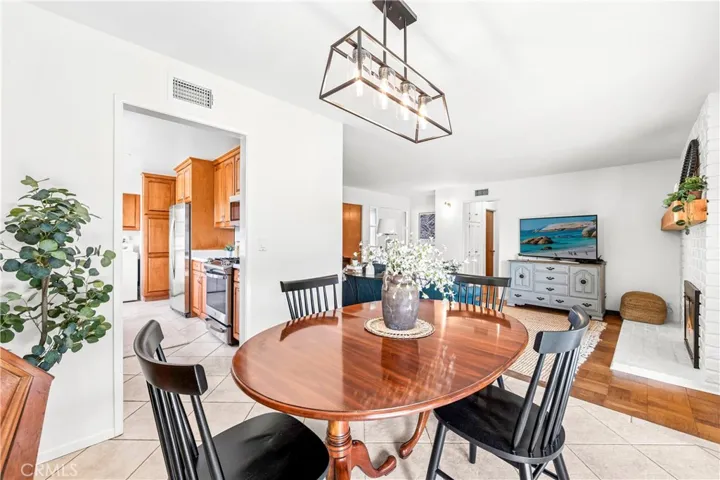Perfectly placed dining room connects kitchen, living room, and covered patio beautifully.