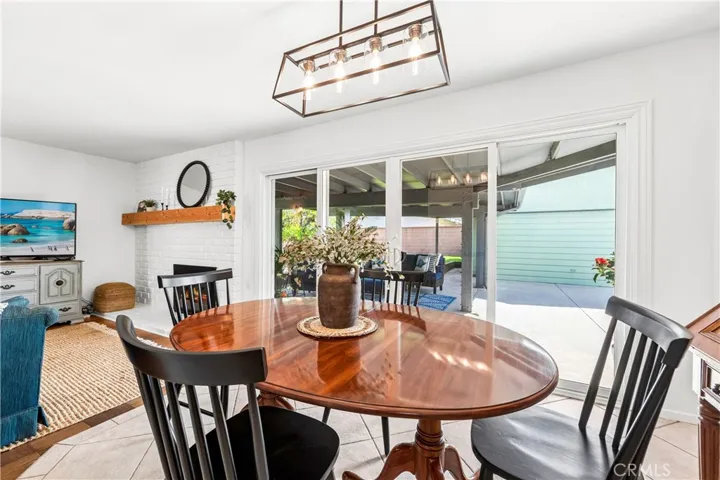 Perfectly placed dining room connects kitchen, living room, and covered patio beautifully.
