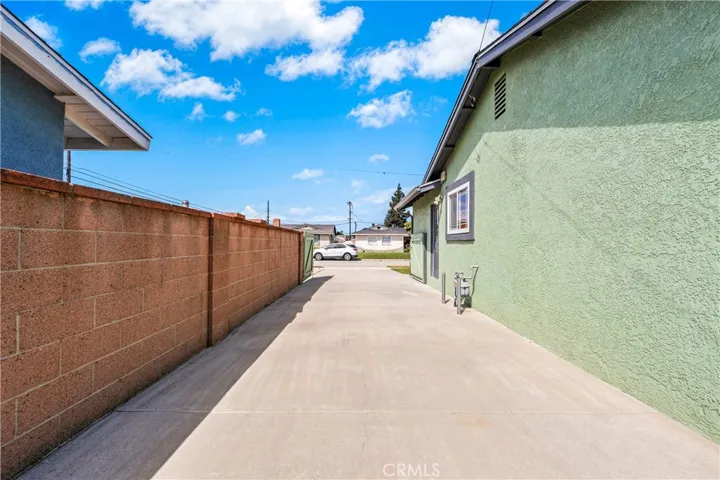 Expansive 77- foot RV driveway with gates creates a safe private play area.