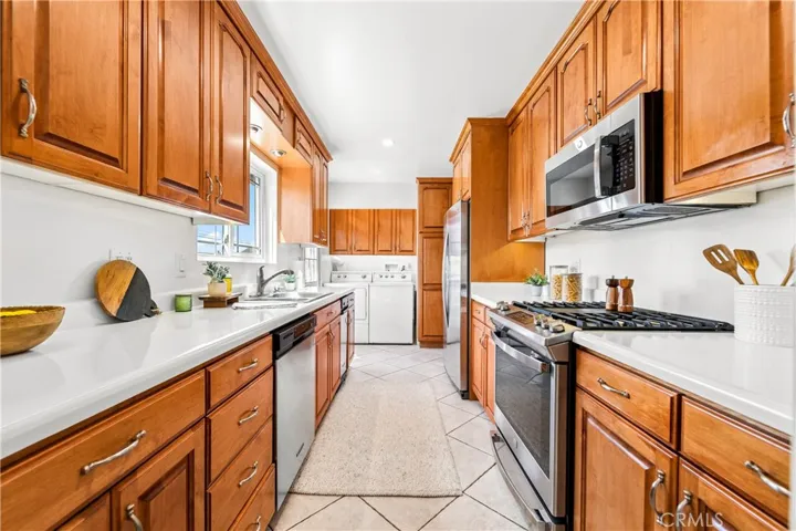 Kitchen has wall-to-wall cabinets for plenty of storage.