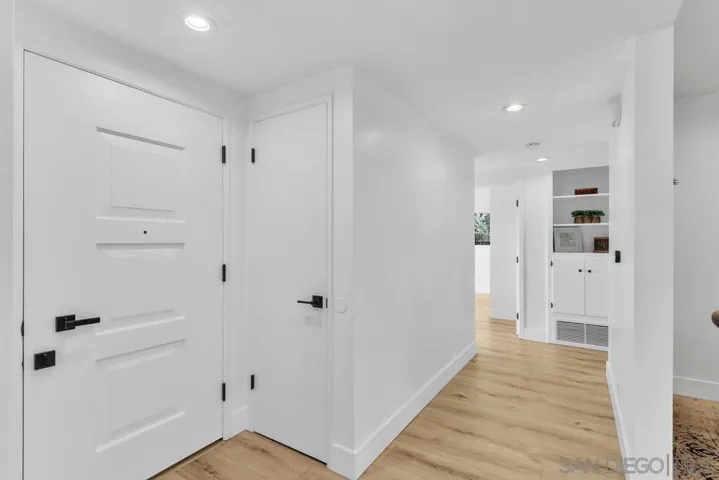 Front door on your left and entry closet on your right. hallway to bedrooms