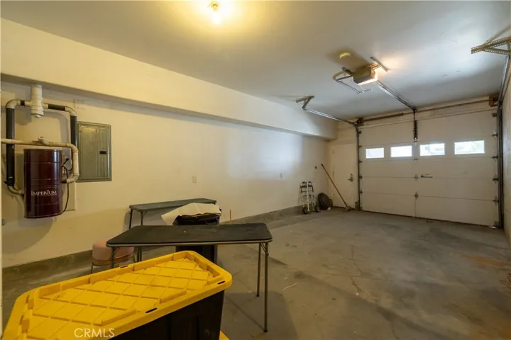 Extra long single car garage accessed from the downslope from the driveway.