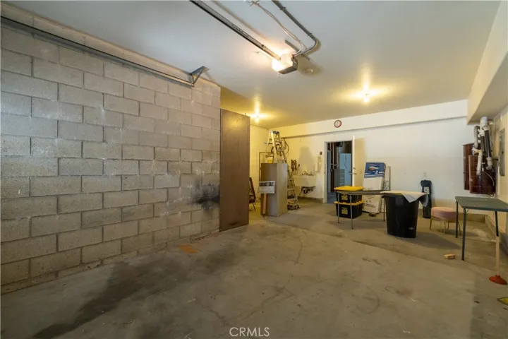 Extra long single car garage accessed from the downslope from the driveway.