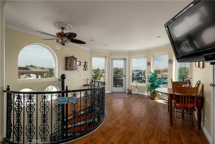 Upstairs landing/retreat with 1/2 bath, balcony and access to roof top deck