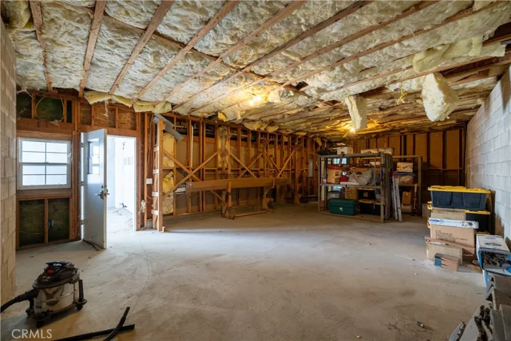 Unfinished space on lower level with separate entry. Could be used for possible ADU,workshop, recording studio, movie theater, etc. Unlimited potential for this extra space!