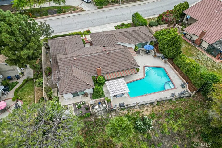 Aerial view of the home. Primary bedroom is left of the image.