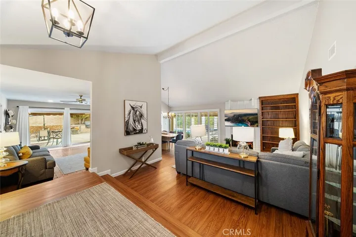 Standing from the landing looking towards the formal living and dining and throughway to the family room. All living area circles around through the kitchen. Sliders available from formal and family room.