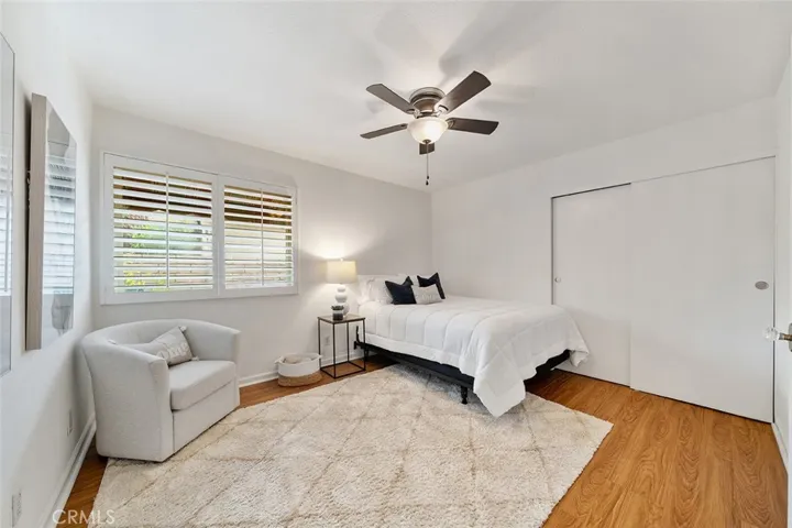 2 of 4 bedrooms at the L of the hallway with double doors. It could also be a guest room or office.