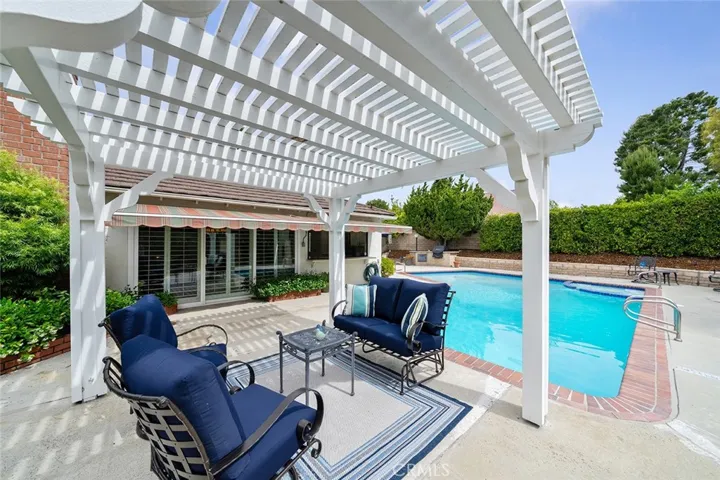 Just enough shade from the pergola while taking in the view of the backyard and golf course.