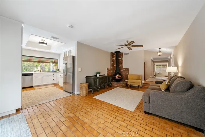 Family room flows to kitchen and entry in the distance; right of image.