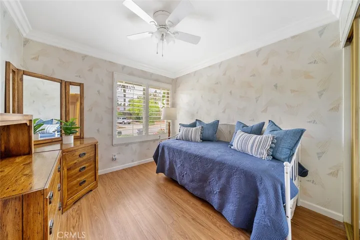 4 of 4 bedrooms. Window faces the front yard. Furniture to remain. Ceiling fan and crown molding adds to the details of the home with pride of ownership.
