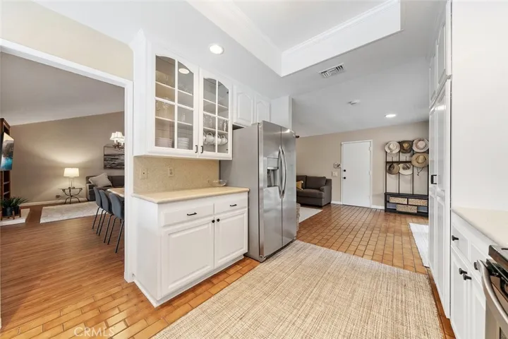 Appliances included. Kitchen is accessible from formal areas and family room. Garage door right of image.