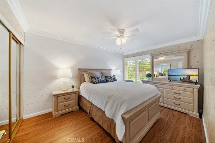 3 of 4 bedrooms. Such a lovely room with crown molding and window facing the front yard. Furniture to remain and enjoy.
