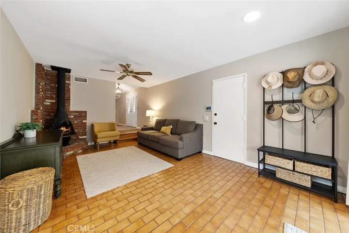 Woodburning stove pipe creates a cozy environment in the family room. Door takes you to the 3 car garage and access to the bonus area.