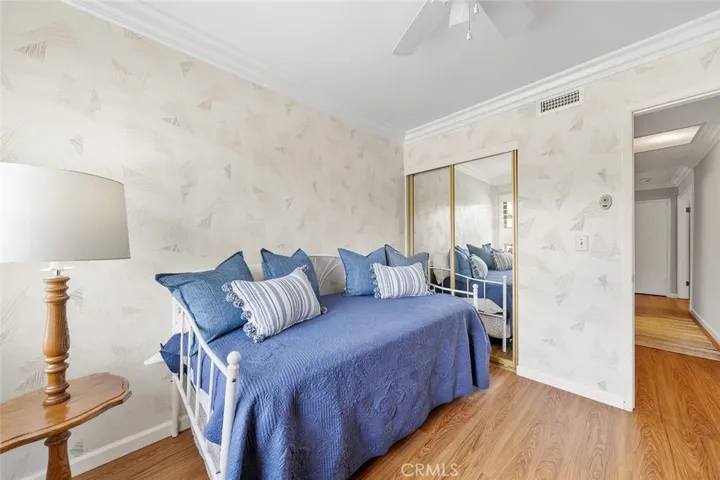 4 of 4 bedrooms. Furniture to remain. Ceiling fan and crown molding adds to the details of the home with pride of ownership.
