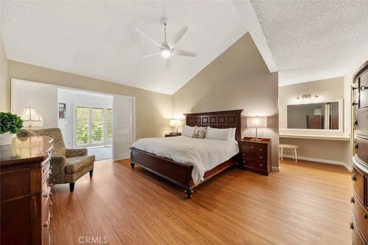 Down the hallway, first on the left takes you to the very roomy primary bedroom with retreat area that has more storage space and sliders to the backyard. En suite right of the image. Furniture to remain for you to enjoy. Just move in.