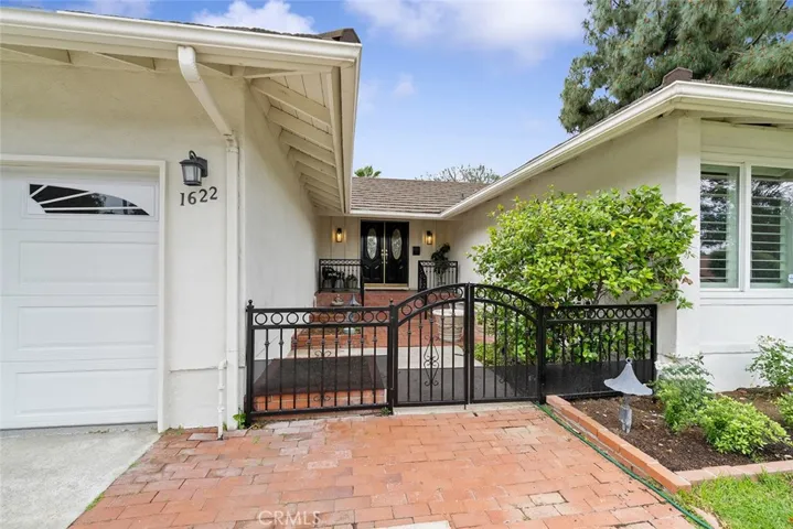 Newly painted wrought iron gate and fence. Pride of ownership the moment you arrive.