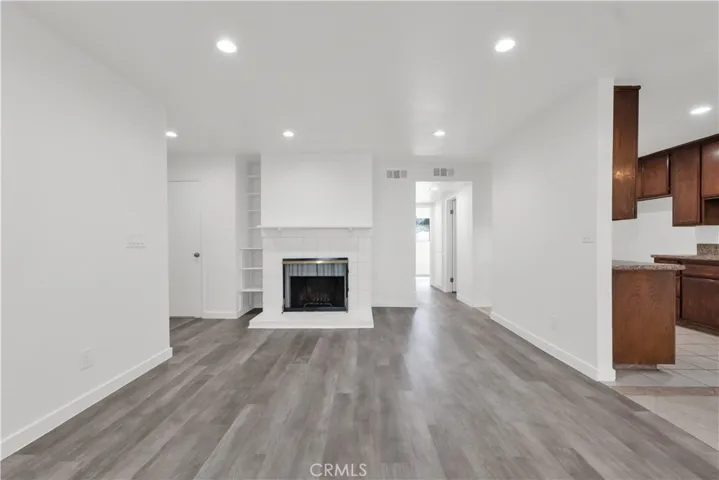 LIVING ROOM WITH COZY FIREPLACE