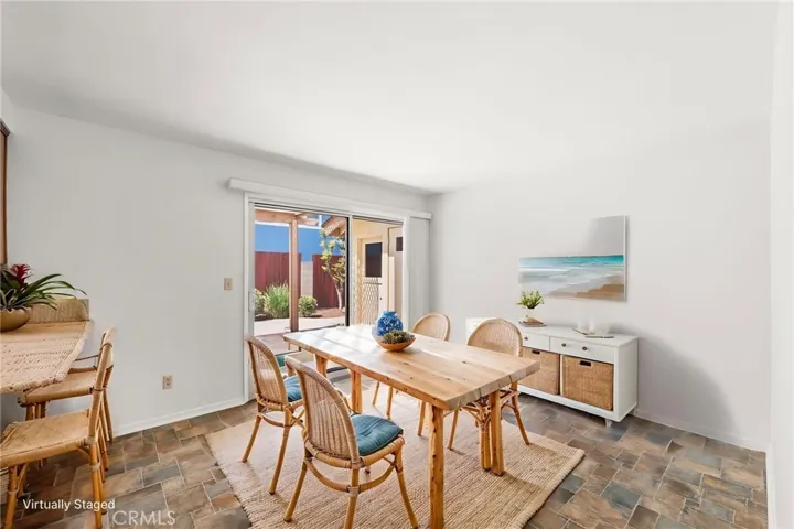 VIRTUALLY STAGED AS DINING AREA. Direct access to side patio.