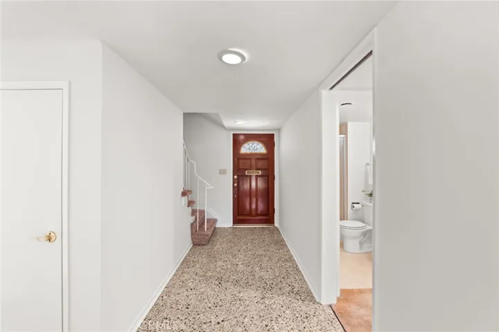 View of front door from inside of home.