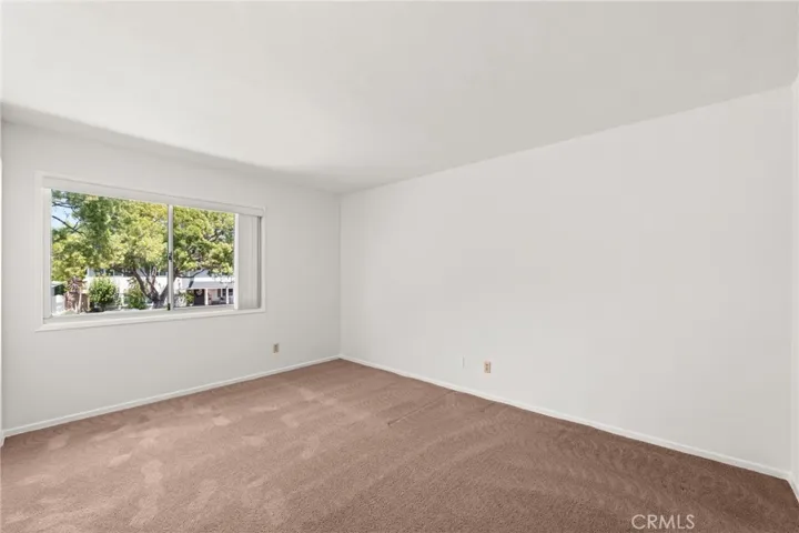 Third of four upstairs bedrooms. Large window creating an open and airy feeling.