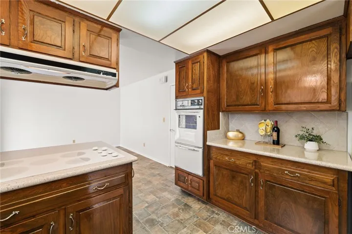 View from kitchen work space into eat in kitchen area or additional living space.