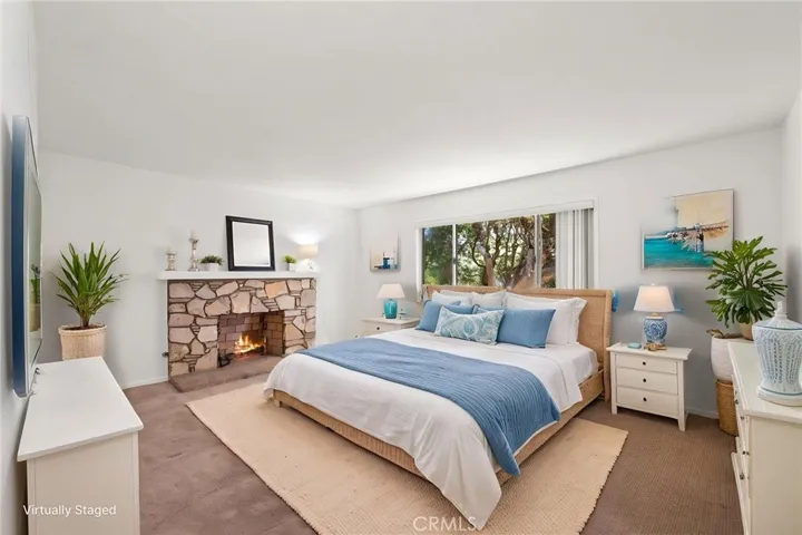 VIRTUALLY STAGED AS PRIMARY BEDROOM.