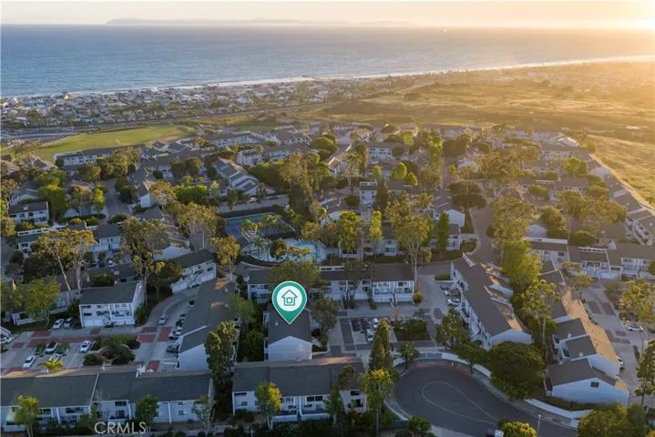 Aerial capturing the home’s location within Newport Crest, offering convenient access to the beach and Newport Beach coastline.