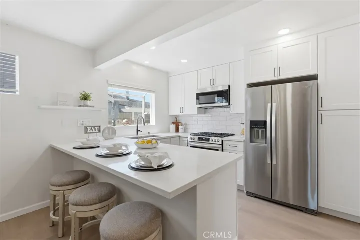 This beautifully remodeled kitchen, updated in 2024, features elegant Carrara white quartz​​‌​​​​‌​​‌‌​​‌​​​‌‌​​​‌​​‌‌​​‌‌​​‌‌​​​​ countertops.