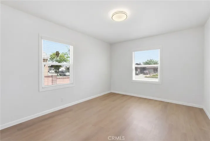 The secondary bedroom features newer dual-pane windows for added comfort and energy efficiency.