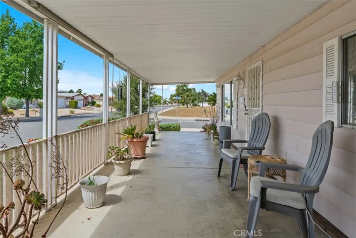 View of covered patio from family room sliding glass door