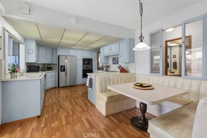 Kitchen has a built-in retro style dinette for casual meals