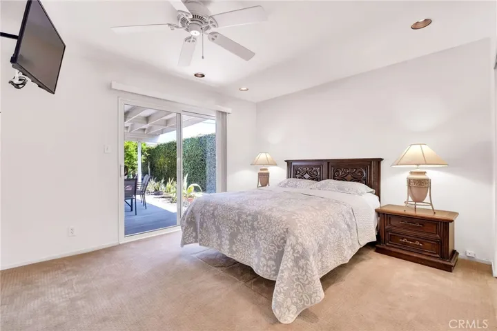 Primary bedroom with direct patio access
