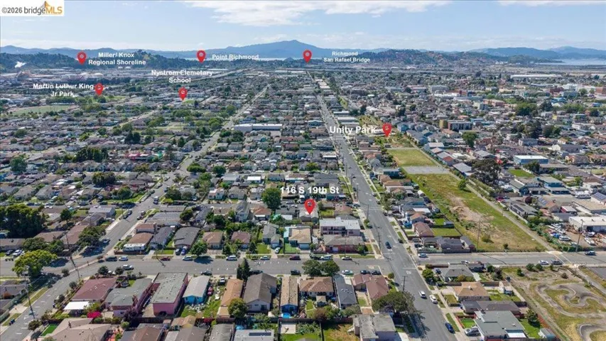 Aerial overview of property's location with nearby suburban area